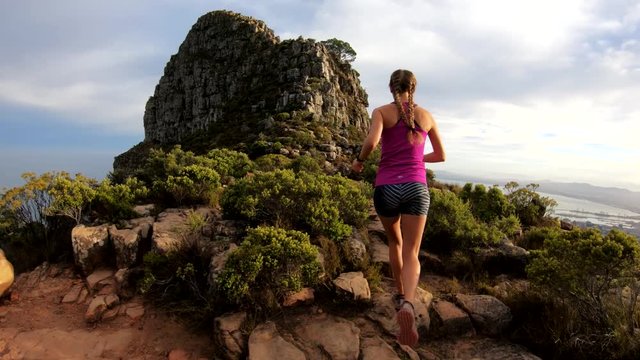POV, hiker on rocky cliffs in Cape Town