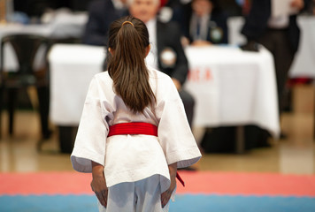 girl karatek preparing to make kata at the championship