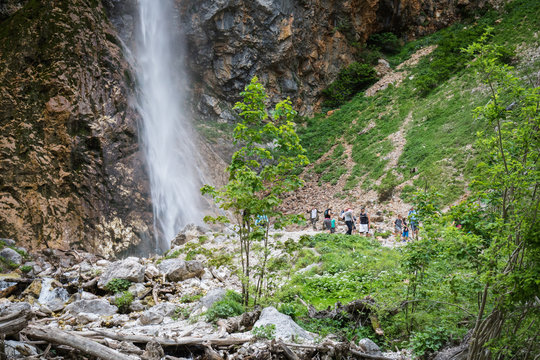Logarska Dolina, Slovenia - June 9, 2018:  Tourists people visiting waterfall rinka in logar valley, slovenia
