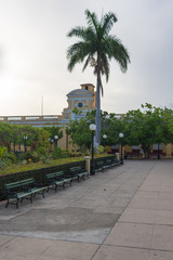Fototapeta premium Benches in park on Carillo square, Trinidad, Cuba