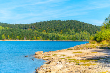 Mountain water reservoir Josefuv Dul, aka Josefodolska Dam, Jizera Mountains, Czech Republic. Sunny summer day.