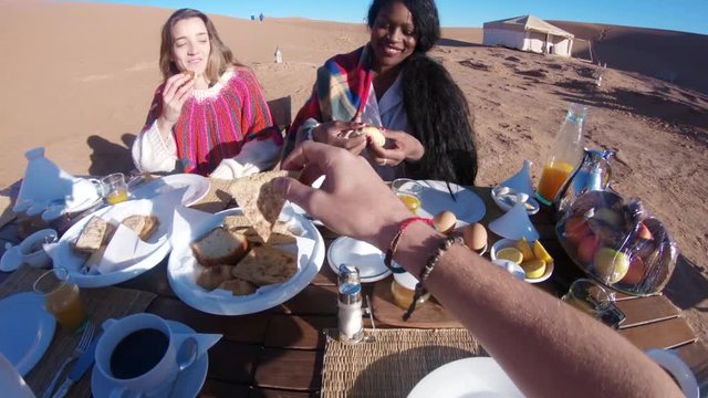 Eating food in desert campsite, POV