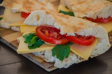 Pita with tomato, cheese and parsley on the nature on the table