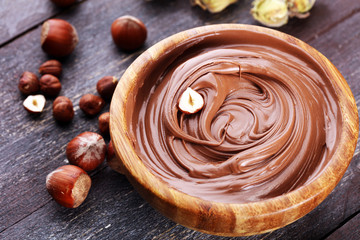 Homemade hazelnut spread in wooden bowl. Hazelnut Nougat cream