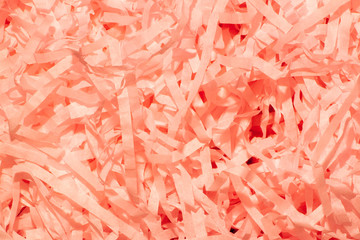 Set of orange thin paper confetti photographed close-up.