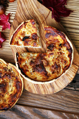 Homemade Cheesy Egg Quiche for Brunch with Spinach and Tomato, onions and zucchini.