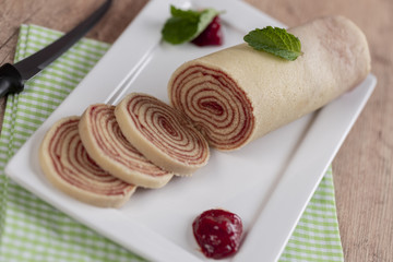 Bolo de rolo (swiss roll, roll cake) typical Brazilian dessert.