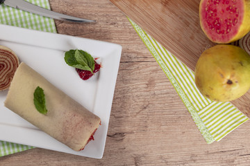 Bolo de rolo (swiss roll, roll cake) typical Brazilian dessert.