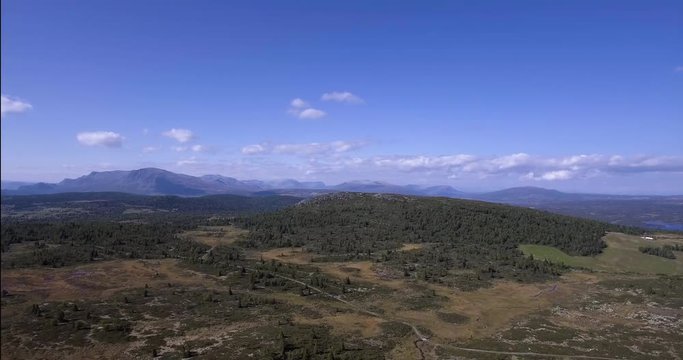 Aerial drone shot from Golsfjellet, a mountain in Hallingdal, Norway. Local mountain top Skogshorn on the left rear part of the frame.