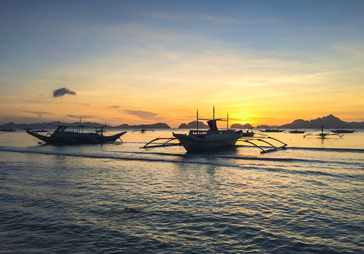 Banka Boats with beautiful sunset at el Nido