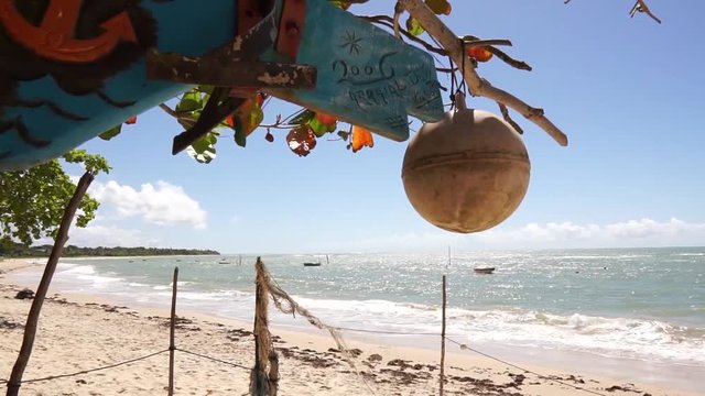 Tropical beach sunny day in Arraial D'Ajuda Bahia Brazil- fisherman&not;&yen;s stuff in the wind no people