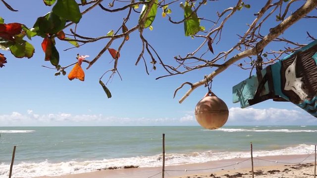 Tropical beach sunny day in Arraial D'Ajuda Bahia Brazil- fisherman&not;&yen;s stuff in the wind