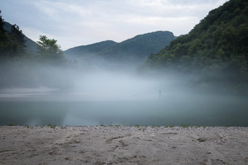misty confluence of Soca and Tolminka river in Slovenia