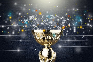 Golden trophy cup on light background