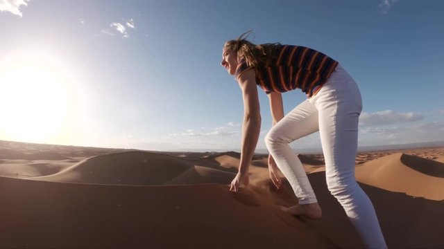 Hiking up desert dunes, POV