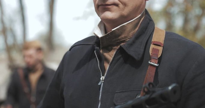 Russian Soviet Crew Member Soldier Of World War II Holding In HandsSub-machine Gun.