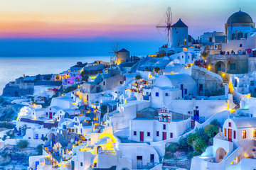 Traveling Concepts. Panoramic View of Famous Old Town of Oia or Ia at Santorini Island in Greece....