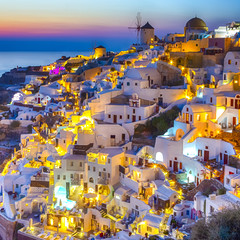Travel Concepts. Skyline of Oia Town with Traditional White Architecture and Iconic Windmills in Village of Santorini in Greece.World Famous Resort. - obrazy, fototapety, plakaty