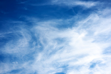 deep blue sky with clouds background