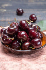 Giant fresh ripe black cherries, new harvest, ready to eat close up
