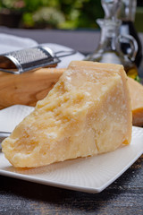 Traditional italian food - 36 months aged in caves Italian parmesan hard cheese from Parmigiano-Reggiano, Italy