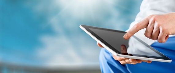 Close-up Doctor at hospital working with tablet