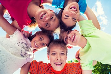 Group of children standing in circle and
