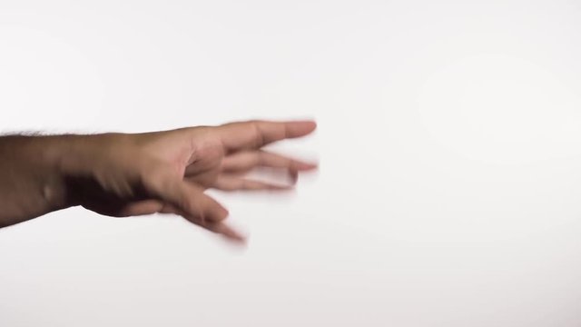 Hand coming into frame showing sort of gesture on white background