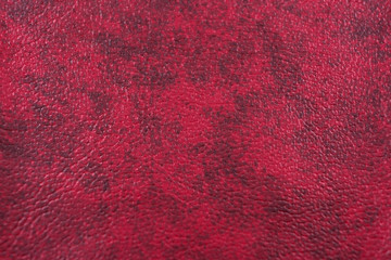 the texture of a leather stained with red tones