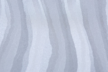 the texture of a fabric with longitudinal waves.