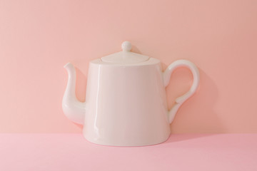 a ceramic white kettle, Pink Two Tone Background