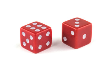 Two red dice, close-up isolated on white background. Six and three.