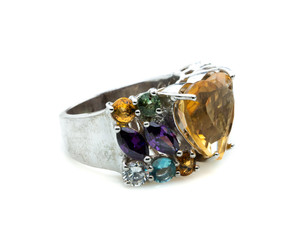 classic ring with a yellow topaz stone on white background