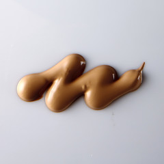 the texture of a foundation liquid, a white background