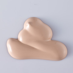 the texture of a foundation liquid, a white background