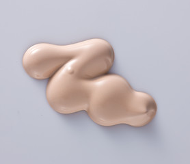 the texture of a foundation liquid, a white background