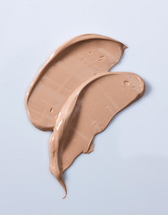 the texture of a foundation liquid, a white background