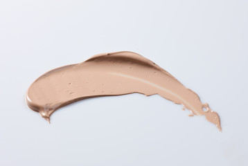 the texture of a foundation liquid, a white background