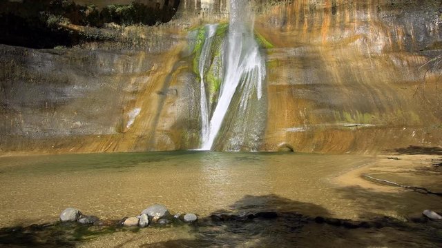 Panning view of oasis waterfall at Lower Calf Creek Falls.