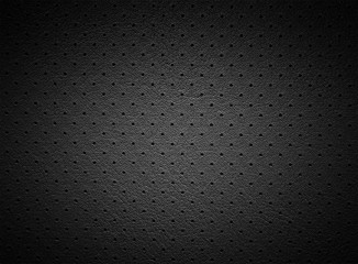 Black Perforated Leather or Skin Texture with Light Spot as Natural Background - 223475153