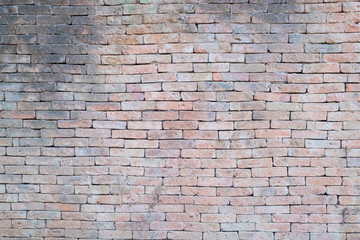 Old red brick wall with background or backdrop.