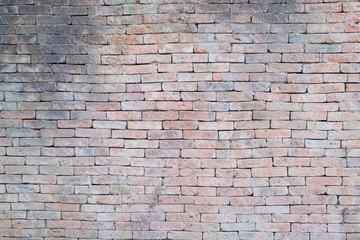 Old red brick wall with background or backdrop.