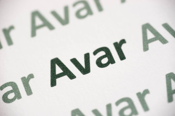 word Avar language printed on paper macro