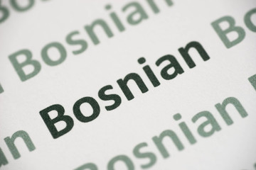 word Bosnian language printed on paper macro