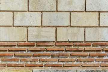 Wall with stones in random size, textured wall for background.