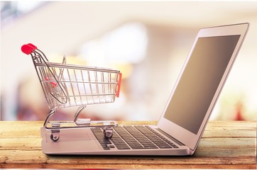 Online shopping concept with laptop and shopping