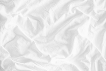 Fototapeta White wrinkled fabic texture rippled surface,Close up unmade bed sheet in the bedroom after night sleep Soft focus obraz