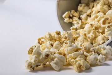 Popcorn in cardboard box isolated on white background