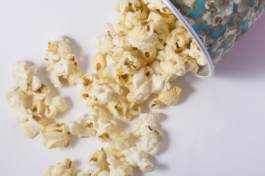 Popcorn in cardboard box isolated on white background