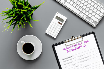 Start of bankruptcy procedure. Petition to file for bankruptcy. Form on grey office desk with...